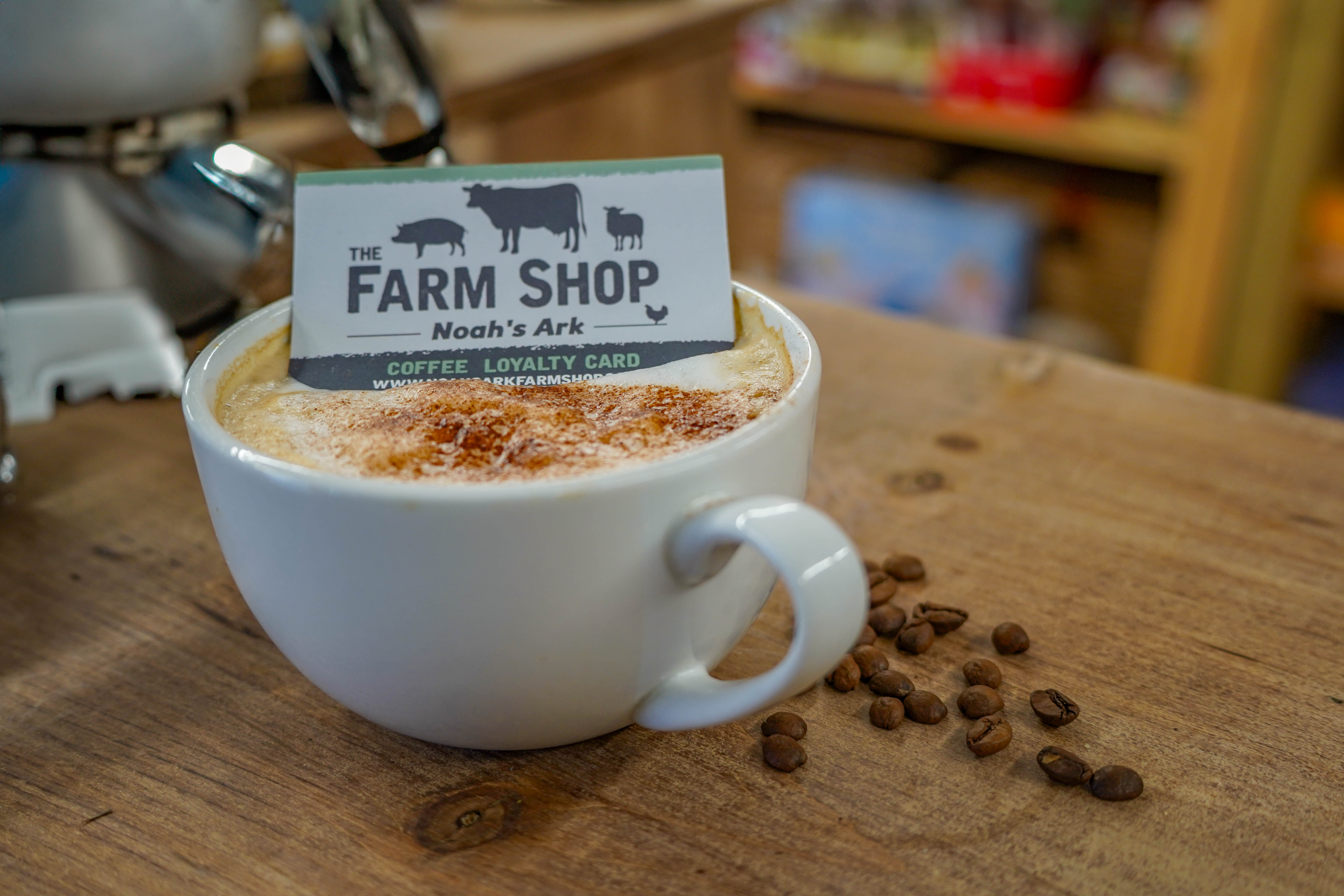 Farm Shop loyalty card resting on cappuccino